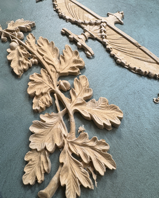 Empire Silicone Mould featuring oak leaves and a classical urn design, used with WoodCast™ to create custom European-style decorative appliqués for furniture and cabinetry.