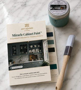 Amy Howard Miracle Cabinet Paint set with color card and paintbrush on marble surface