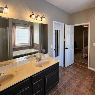 Before and after bathroom transformation using Manor Borne interior wall paint in Waitin On The Day and Cotton Blossom by Amy Howard At Home