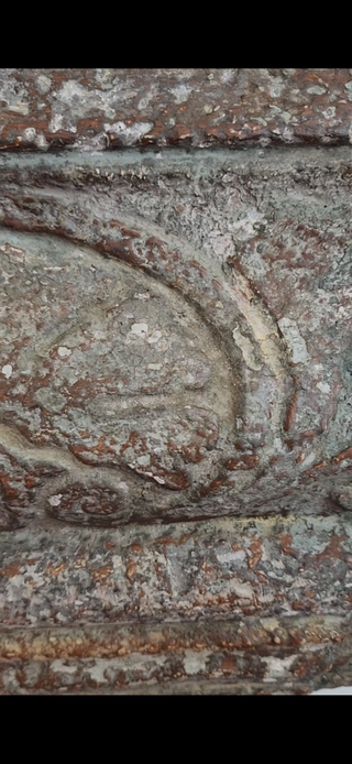 Close-up of Weathered Chapel Patina finish showing oxidized green and rust tones on carved architectural detail using Amy Howard At Home milk paint