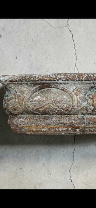 Close-up of Weathered Chapel Patina finish showing oxidized green and rust tones on carved architectural detail using Amy Howard At Home milk paint