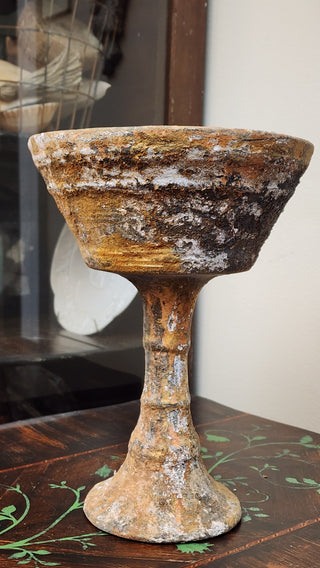 Weathered Finish with layered rusted patina and cracked texture on decorative surface.