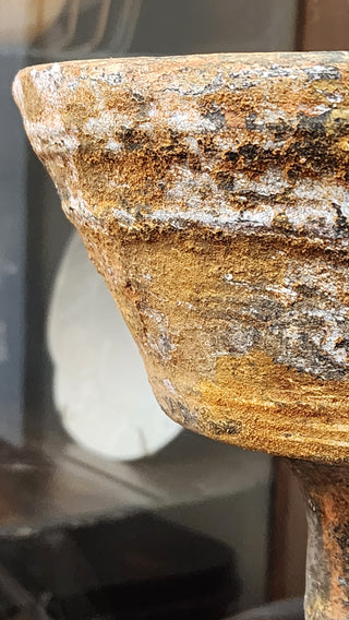 Weathered Finish with layered rusted patina and cracked texture on decorative surface.