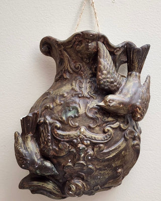 Plain dark bronze bird wall pocket before Aged Sterling Patina Finish transformation by Amy Howard At Home