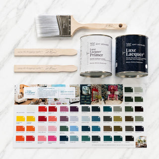 Amy Howard At Home LuxeLacquer bundle with LuxeLacquer paint, primer, brush, stir sticks, and color guide on marble background