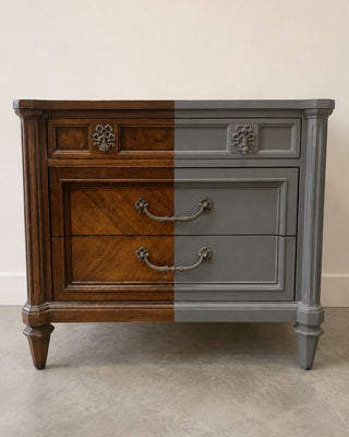 Before and after split view of an antique dresser transformed with Amy Howard One Step Paint in a grey finish showing the original wood stain on the left and the painted finish on the right
