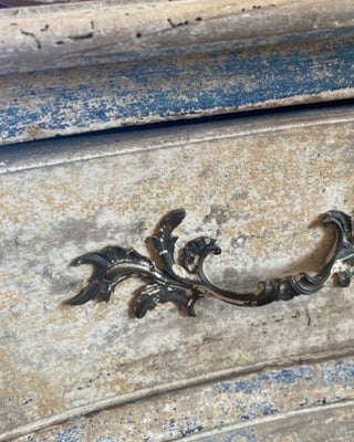 Antique French furniture with naturally aged crackled paint, warm golden tones, and faded blue details used as inspiration for the Provence Patina Finish by Amy Howard At Home