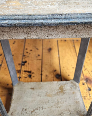Close-up of Provence Patina Finish tabletop showing layered warm golden and grey crackled gesso texture with blue trim by Amy Howard At Home