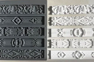 Amy Howard At Home Renaissance Decorative Silicone Mould shown side by side with five finished CeramiCast ornamental border strip castings showing the mould to finished casting result
