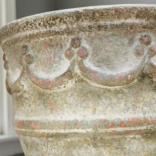 Close-up of Sun-Faded Calais Patina Finish showing crackled texture, soft limestone tones, and faded coral undertones on a decorative planter by Amy Howard At Home