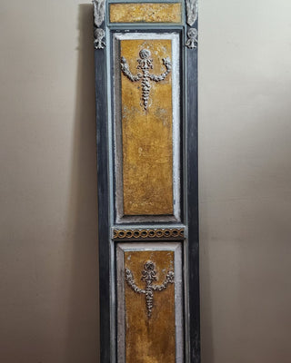 Finished architectural panel in the Tuscan Ochre & Ash Architectural Panel Finish, featuring an aged Versailles appliqué by Amy Howard At Home.
