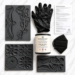 Amy Howard At Home WoodCast beginner bundle with WoodCast compound, decorative moulds, gloves, KN95 mask, and instruction sheet on marble background