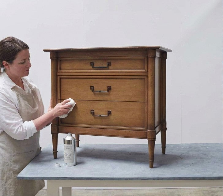 Before: wood nightstand being cleaned in the studio